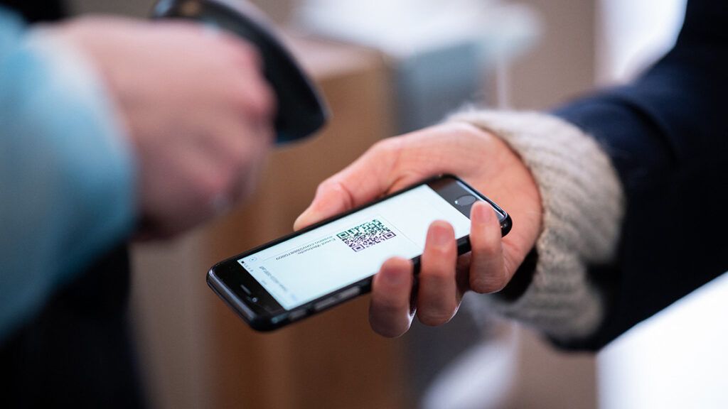 Woman scans a QR code on her smartphone