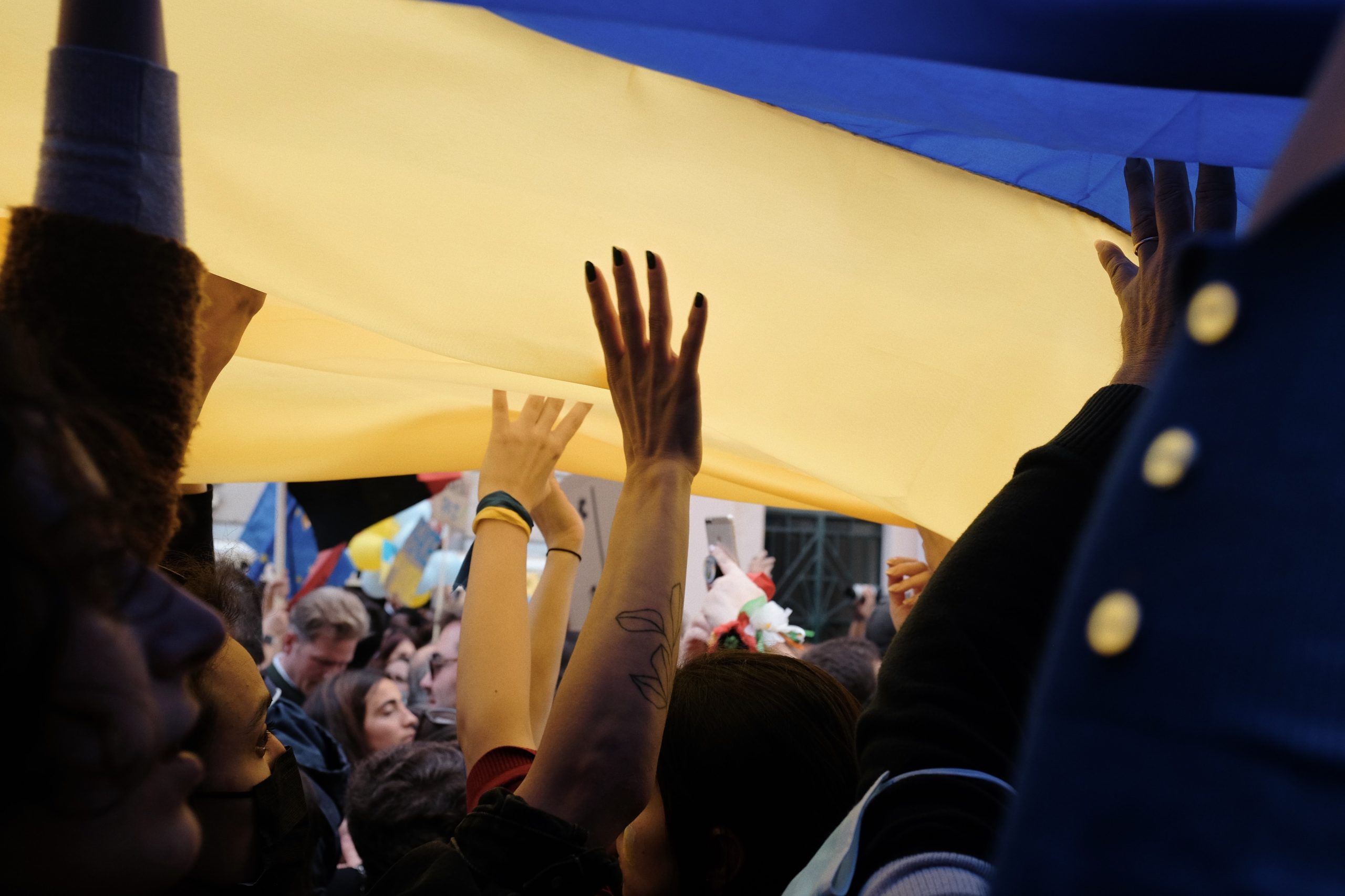 Hands holding ukranian flag