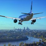 avion aterrizando sobre un paisaje de ciudad